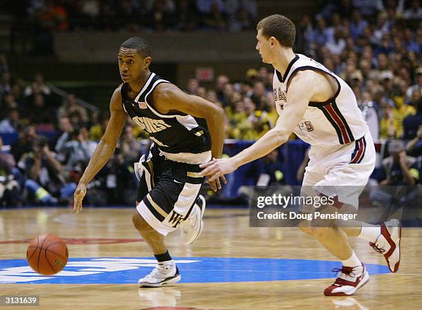 Justin Gray of the Wake Forest Demon Deacons dribbles around Pat Carroll of the St. Joseph's Hawks during their third round game of the NCAA Division...