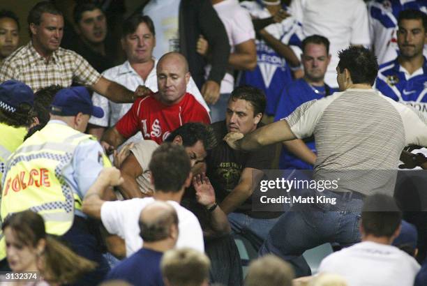 Police attempt to break up a fight between fans during the Round 3 NRL match between the Sydney Roosters and the Bulldogs held at Aussie Stadium...