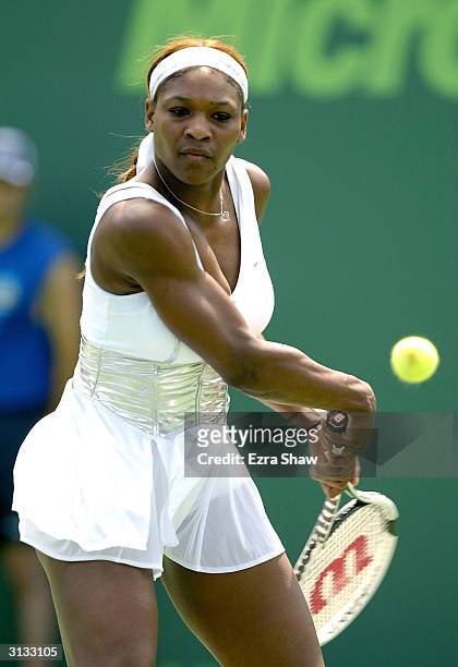 Serena Williams returns a shot to Marta Marrero of Spain during the Nasdaq-100 Open March 26, 2004 at the Crandon Park Tennis Center on Key Biscayne...