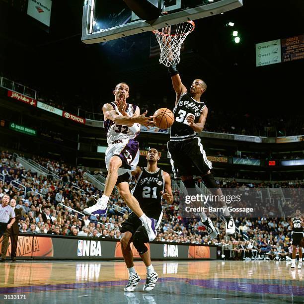 Jason Kidd of the Phoenix Suns makes a pass against the San Antonio Spurs during an NBA game circa 2000 in Phoenix, Arizona. NOTE TO USER: User...