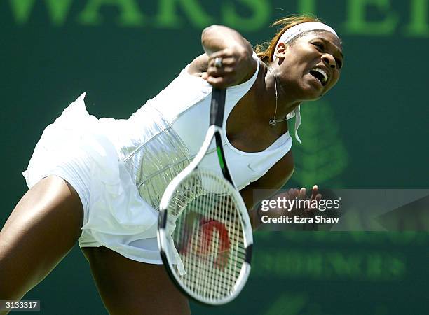 Serena Williams serves to Marta Marrero of Spain during the Nasdaq-100 Open March 26, 2004 at the Crandon Park Tennis Center on Key Biscayne in...