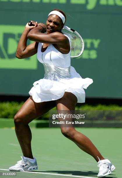 Serena Williams returns a shot to Marta Marrero of Spain during the Nasdaq-100 Open March 26, 2004 at the Crandon Park Tennis Center on Key Biscayne...