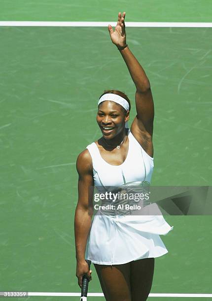 Serena Williams of the USA waves to the crowd after defeating Marta Marrero of Spain during The Nasdaq 100 on March 26, 2004 in Miami, Florida.