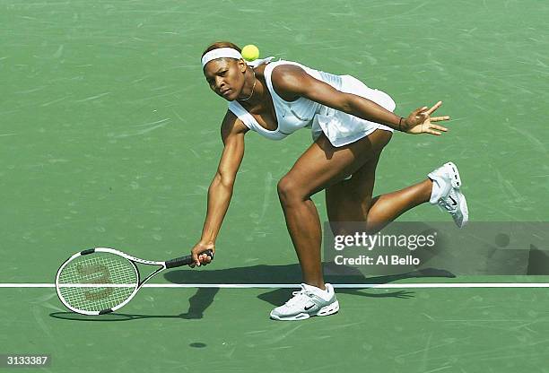 Serena Williams of the USA plays a forehand against Marta Marrero of Spain during The Nasdaq 100 on March 26, 2004 in Miami, Florida.