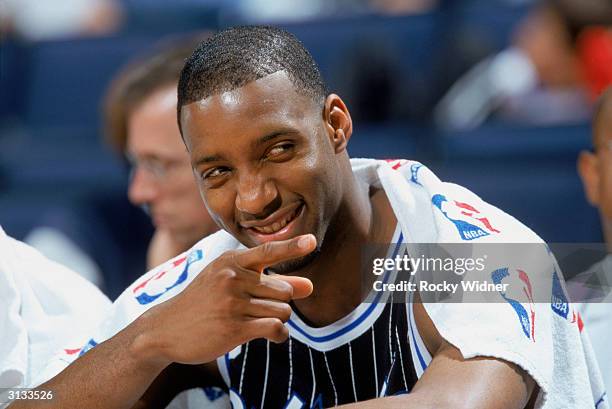 Tracy McGrady of the Orlando Magic enjoys a moment during the NBA game against the Golden State Warriors at The Arena in Oakland on March 17, 2004 in...