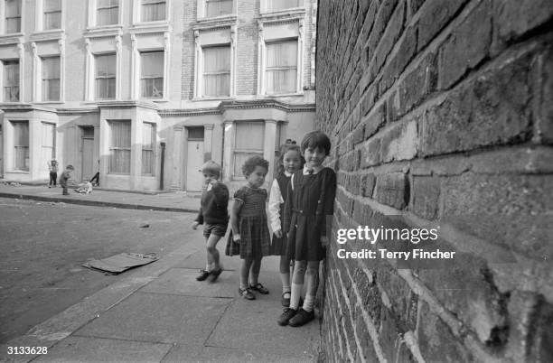 Children playing outside 10 Rillington Place, London, the home of the mass murderer, John Christie.