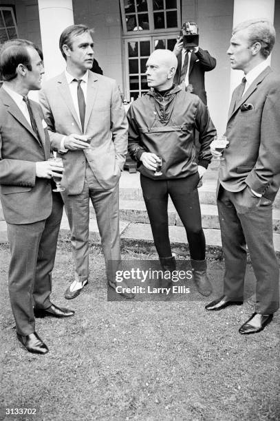 From left to right, Jimmy Greaves, Sean Connery, Yul Brynner and Bobby Moore during a visit by the England football team to Pinewood Studios.