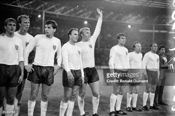 Members of the England football team, Roger Hunt, Jack Charlton, Martin Peters, Ray Wilson, Bobby Moore, Geoff Hurst, Nobby Stiles and George Cohen...