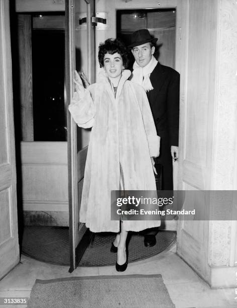 Actress Elizabeth Taylor with her husband Michael Wilding the day before their wedding at Caxton Hall.