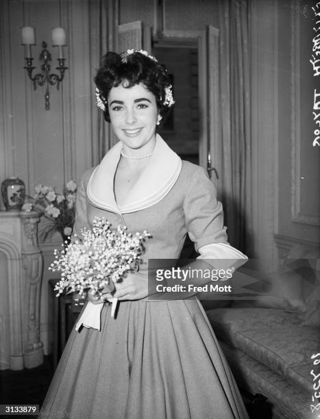 British-born actress Elizabeth Taylor on the day of her wedding to Michael Wilding.