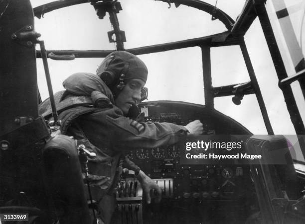 Sergeant John McKintosh of the RAF starts the engine of his Lancaster bomber after a painstaking check of the plane's systems. Original Publication:...