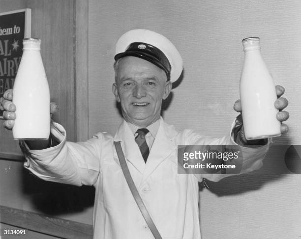 Mr George Jones of Llandudno is voted Personality Milkman of 1964, and comes to receive his prize at the National Dairy Centre in Charing Cross Road,...