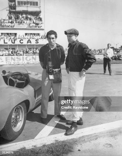 Racing driver Mike Hawthorn with his co-driver, the Marquis de Portago at Goodwood racing track.