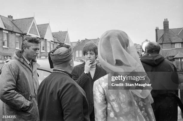 British pop group the Beatles on location in London for the filming of the musical 'Help'.