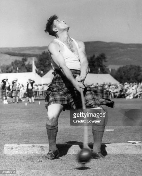 Sandy Sutherland of Ardoss, throwing the hammer during the Royal Highland gathering at Braemar.