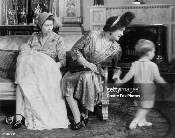 Elizabeth , consort of King George VI, with her daughter, later Queen Elizabeth II, and grandchildren Charles and Anne, at Princess Anne's...