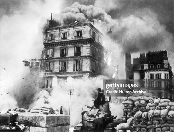 The city of Rouen is envoloped by smoke and fire during the German invasion of World War II.