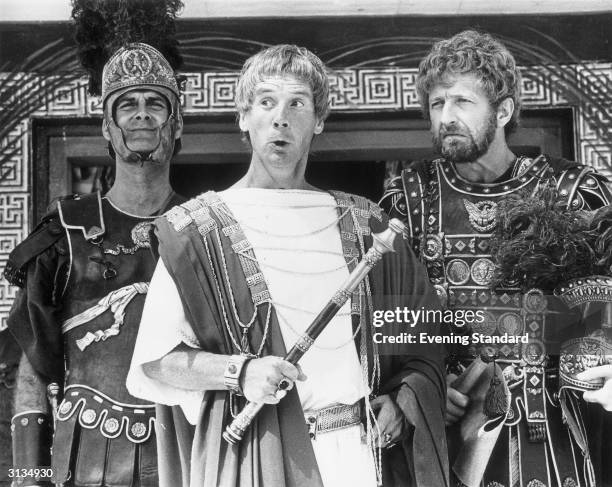 Members of the British comedy team, Monty Python, during the filming of their controversial film 'The Life of Brian', John Cleese as a centurion,...