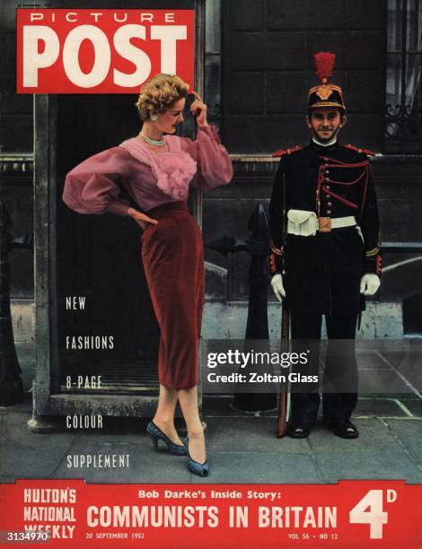 Model wearing Hubert de Givenchy's 'rose theme' outfit of blouse and velvet skirt flirts with a soldier 'en-guard' in ceremonial uniform of the...