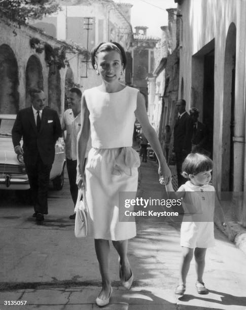 Princess Lee Radziwill, the sister of Jackie Kennedy, with her young son Anthony Radziwill in Ravello. Prince Radziwill is walking behind his wife on...