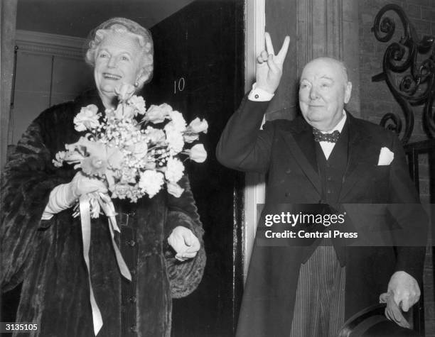British Conservative politician Winston Churchill and his wife, Clementine, outside number ten Downing Street, London, on his 80th birthday.