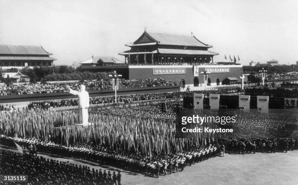 Over a million Red Guards, carrying flags and a huge statue of Chairman Mao, at the 1st of October celebrations in Beijing.