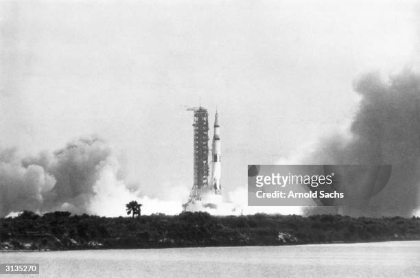The Apollo 11 Saturn V rocket lifts off its pad at Kennedy Space Centre in Florida, carrying astronauts Neil Armstrong, Buzz Aldrin, and Michael...