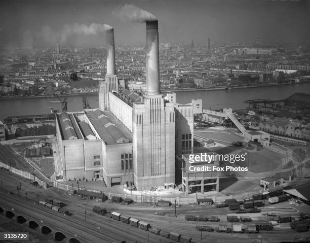 Battersea Power Station on the River Thames in London, designed by architect Giles Gilbert Scott. The other two towers were not added until 1953,...