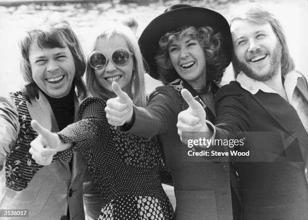 Swedish pop group ABBA give the thumbs up after winning the Eurovision Song Contest with their song 'Waterloo', Brighton, 7th April 1974. Left to...