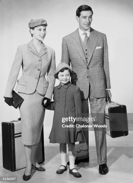 Family dressed and packed for a holiday.