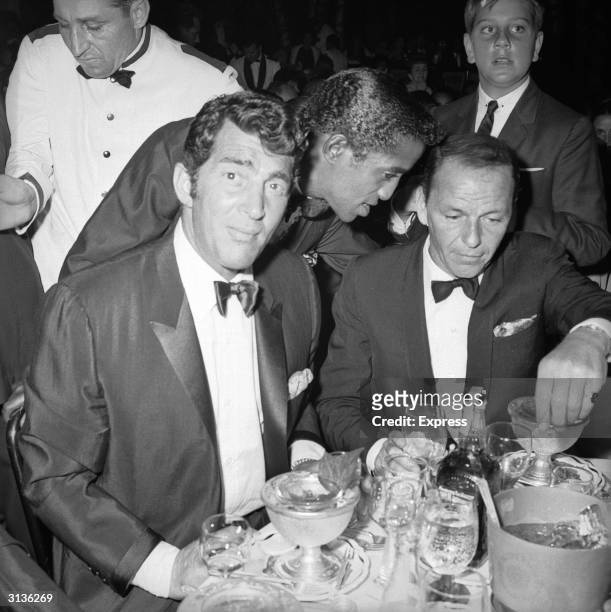 Dean Martin , Sammy Davis Junior and Frank Sinatra at the Cocoanut Grove club, Hollywood, for Eddie Fisher's opening night.