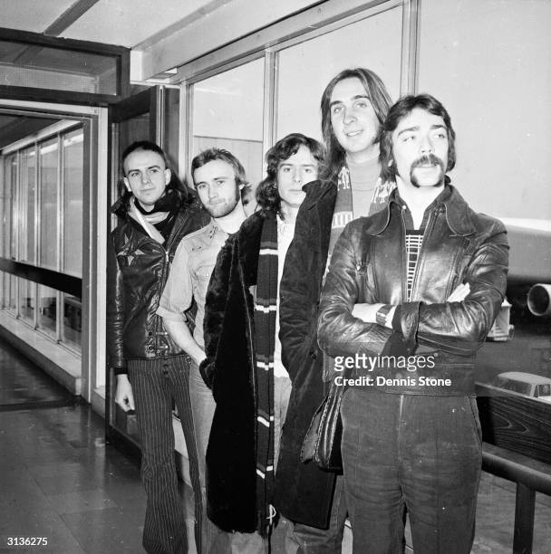 British rock group Genesis, Peter Gabriel, Phil Collins, Tony Banks, Mike Rutherford and Steve Hackett at London Airport.