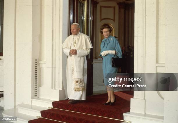 Pope John Paul II with Queen Elizabeth II of Great Britain at Buckingham Palace.
