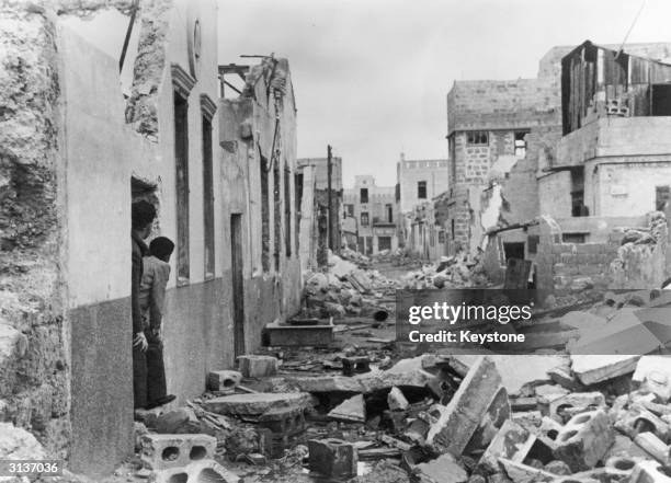 Members of the Haganah, the Jewish defence force keep a look-out for possible Arab looters in the destroyed Jewish border are between Jaffa and Tel...