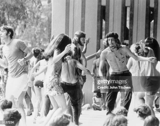 Hawaiian teenagers dancing at a free rock concert in Honolulu's Kapiolani Park.