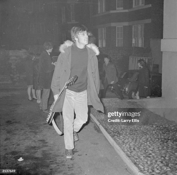 John Lennon of the Beatles arrives at the EMI studios in Abbey Road, London.