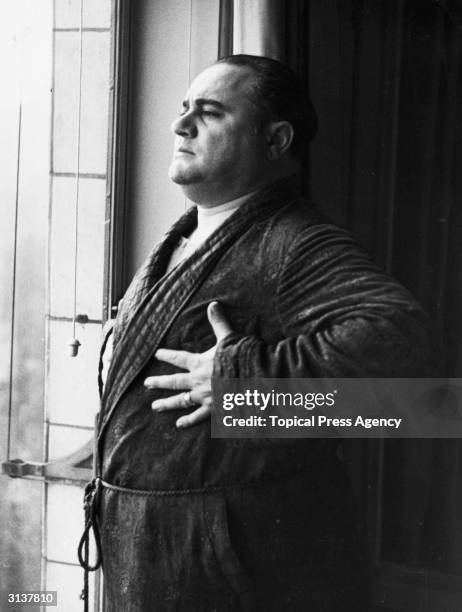 The Italian tenor Beniamino Gigli carrying out his breathing exercises in London. He is on a month long tour of sixteen British cities.