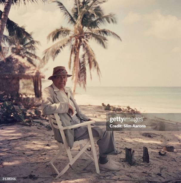 Premium Rates Apply. Anglo-American poet and playwright, TS Eliot at Love Beach, New Providence Island while on his honeymoon in the Bahamas, 1957. A...