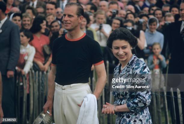 Prince Philip, captain of the Windsor Park Team, with the Windsor Cup after his team beat India during the Ascot week Polo tournament of which he is...