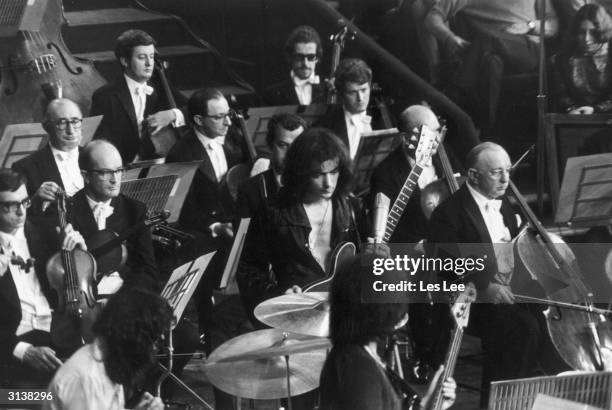 Ritchie Blackmore, lead guitarist with British rock band 'Deep Purple', in concert at the Royal Albert Hall in London. Deep Purple's keyboardist and...