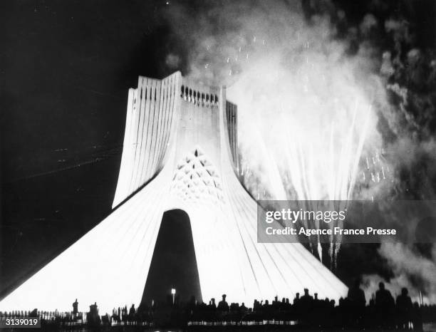 Firework display round the Chahyade Tower in Teheran built to celebrate the 2500th anniversary of the founding of the Persian empire.