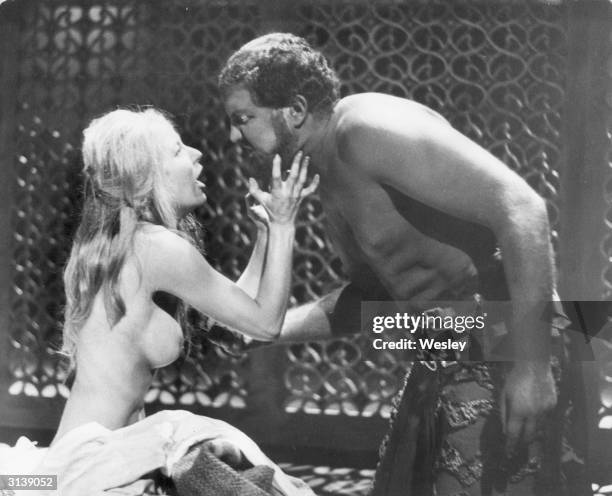 Actress Sarah Stephenson as Desdemona appears nude in a scene with Bruce Purchase as Othello in a scene from Shakespeare's play of the same name at...