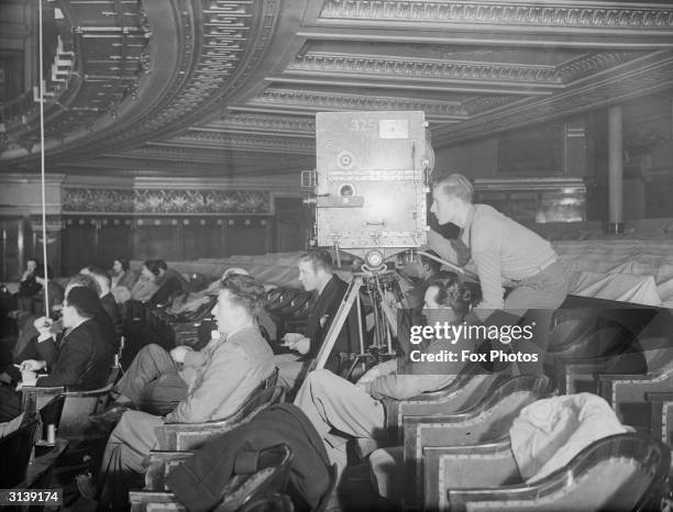 People in the stalls of the Drury Lane theatre in London, watching the filming of the ballet 'Escape Me Never'.
