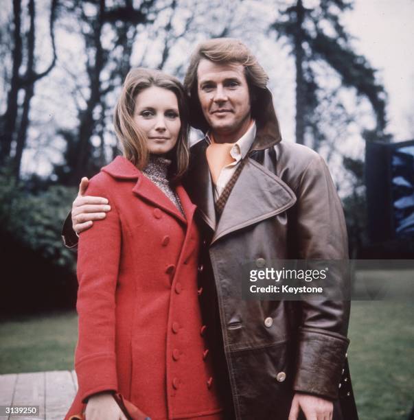 British actor Roger Moore sports a coiffured hairdo as Lord Brett Sinclair in the 70s television series 'The Persuaders'. Next to him is German...