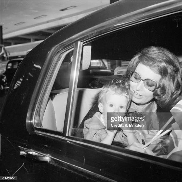 Italian actress Sophia Loren at London Airport with her younger son Edoardo Ponti.