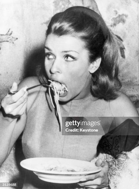 Austrian actress, Senta Berger enjoying a plate of spaghetti at the Cinecitta in Rome during the filming of 8Operation Saint Gennarioe.