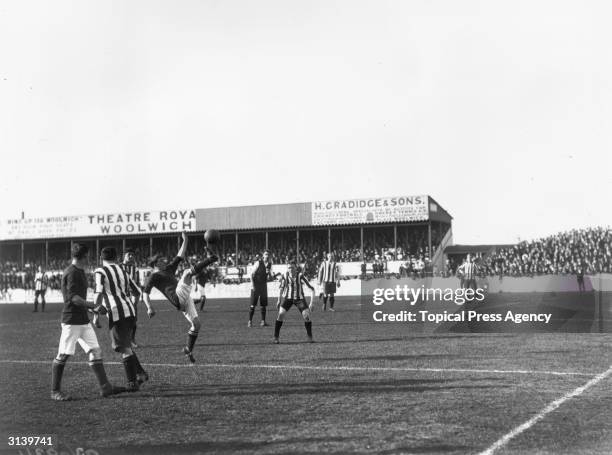 Woolich forward in action during a Woolwich-Arsenal match against Liverpool. Previously known as Dial Square and then Royal Arsenal, Woolwich Arsenal...