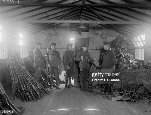 Demobilised British soldiers hand over their service kit, , after signing off on completion of army service at a depot in Wimbledon, London, at the...