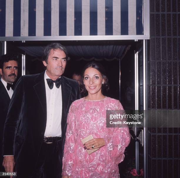 American actor Gregory Peck and his wife Veronique Peck attend the premiere of the James Bond film 'Live and Let Die'.