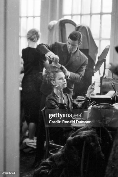 French model having her hair done backstage at a fashion show in Victoria.